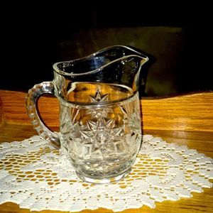 Small Anchor Hocking pitcher. 6 1/2 inches across and 6 inches high.